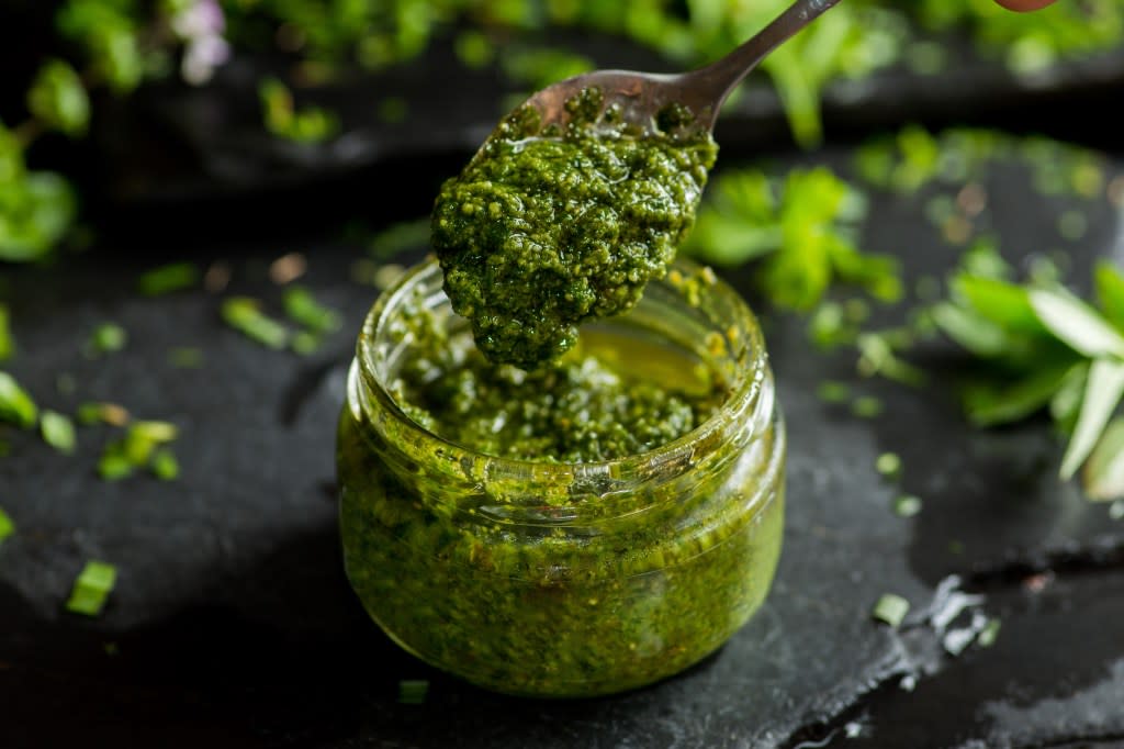 Ingredients like olive oil, parmesan cheese and pine nuts make pesto a high-fat, high-calorie spread. smirart - stock.adobe.com