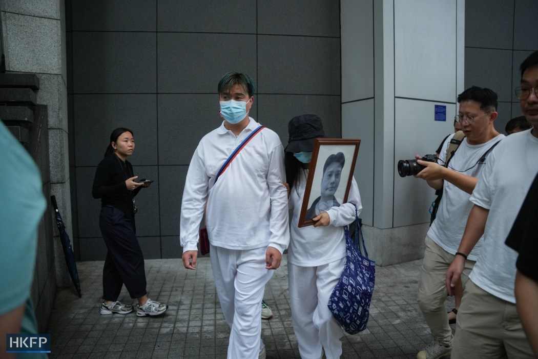 The family of a man who died after being shot by the police walked out of the police station after filing a complaint against the police on September 22, 2024. Photo: Kyle Lam/HKFP.