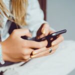 Stock photo of a woman using a smartphone.