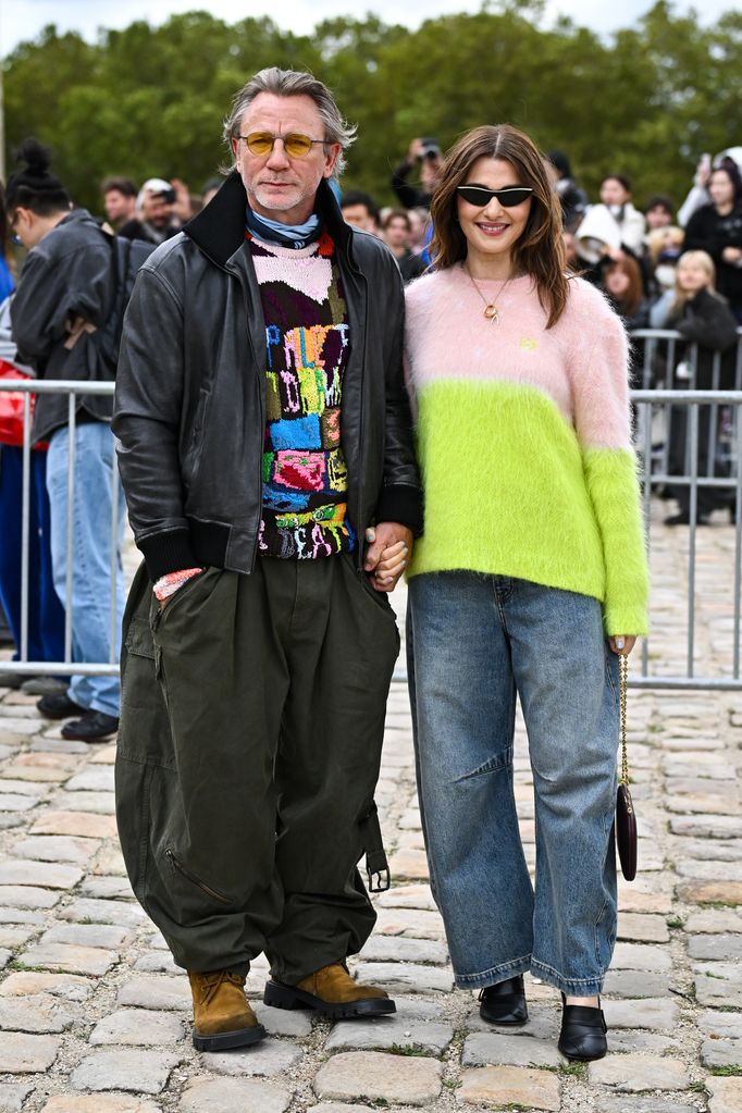 Daniel Craig and Rachel Weisz are wearing wide leg pants and jumpers